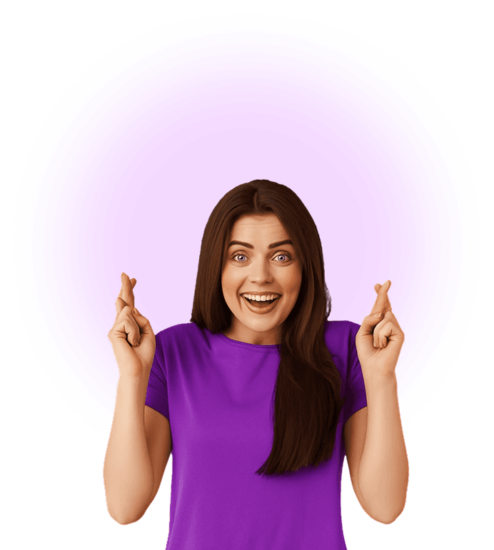 Excited woman in purple shirt with crossed fingers